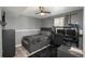 Cozy bedroom with wood-look floors, neutral walls, and a dedicated workspace at 772 Lewiston St, Aurora, CO 80011