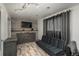 This living area has a stylish gray sofa bed and updated decor at 772 Lewiston St, Aurora, CO 80011