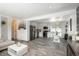 Open-concept living area flowing into a dining area and kitchen, ideal for entertaining guests at 772 Lewiston St, Aurora, CO 80011