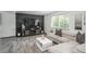 Cozy living room with a stone accent wall, entertainment center, and a comfortable sectional sofa at 772 Lewiston St, Aurora, CO 80011