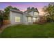The backyard features a well-maintained lawn, a wooden deck, and landscaping at 11263 Vrain Dr, Westminster, CO 80031