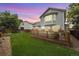 The backyard features a well-maintained lawn, a wooden deck, and landscaping at 11263 Vrain Dr, Westminster, CO 80031