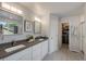 Bathroom with dual sinks, and a walk-in closet providing ample storage space at 11263 Vrain Dr, Westminster, CO 80031