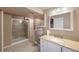Bathroom featuring a shower with glass door and a vanity with granite countertop at 11263 Vrain Dr, Westminster, CO 80031