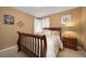 Bedroom features hardwood floors, light tan walls, and a picturesque window view at 11263 Vrain Dr, Westminster, CO 80031