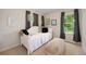 Charming bedroom with natural light, featuring modern decor, soft lighting, and a comfortable daybed at 11263 Vrain Dr, Westminster, CO 80031