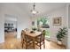 Charming dining room with hardwood floors, a wooden table, and a large window at 11263 Vrain Dr, Westminster, CO 80031