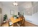 Bright dining area with hardwood floors conveniently located between living room and stairwell at 11263 Vrain Dr, Westminster, CO 80031