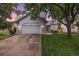 Charming two-story home boasts a well-manicured lawn and attached two car garage at 11263 Vrain Dr, Westminster, CO 80031