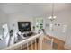 Bright and airy living room boasts vaulted ceilings, large windows, and an open floor plan at 11263 Vrain Dr, Westminster, CO 80031