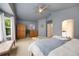Bright main bedroom featuring a ceiling fan, ensuite bath access, and plenty of natural light at 11263 Vrain Dr, Westminster, CO 80031