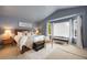 Main bedroom with a large window, vaulted ceiling and neutral tones at 11263 Vrain Dr, Westminster, CO 80031
