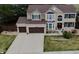 Aerial view of a two-story home showing roof, driveway, and landscaping at 11710 Crow Hill Dr, Parker, CO 80134