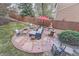 Backyard patio with fire pit, seating area, and stone pavers at 11710 Crow Hill Dr, Parker, CO 80134