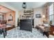 Charming bar area with dark wood bar, open shelving and decor for entertaining at 11710 Crow Hill Dr, Parker, CO 80134