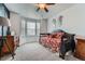 Comfortable bedroom featuring a daybed, bay window, and unique decor at 11710 Crow Hill Dr, Parker, CO 80134