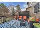 Cozy outdoor deck with comfortable seating and patterned rug at 11710 Crow Hill Dr, Parker, CO 80134