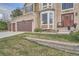 View of the two-car garage and front entrance to the home at 11710 Crow Hill Dr, Parker, CO 80134