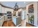 Kitchen featuring stainless steel appliances, hardwood floors, and a granite-topped island at 11710 Crow Hill Dr, Parker, CO 80134