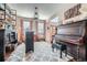 Bright living room with high ceilings, grand piano, and bar area with decor at 11710 Crow Hill Dr, Parker, CO 80134