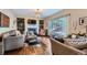 Cozy living room with a fireplace, hardwood floors, and lots of natural light at 11710 Crow Hill Dr, Parker, CO 80134