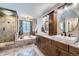 Elegant main bathroom with double sinks, soaking tub, and separate shower stall at 11710 Crow Hill Dr, Parker, CO 80134