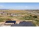 Expansive property boasting an additional outbuilding, surrounded by natural landscapes and distant mountain views at 14025 Florence Ct, Brighton, CO 80602