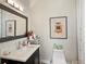 Stylish bathroom featuring a modern vanity, large mirror, and elegant decor that will make you swoon at 14025 Florence Ct, Brighton, CO 80602