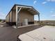 Large multi-purpose building with metal siding and covered area at 14025 Florence Ct, Brighton, CO 80602