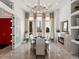 Formal dining room with fireplace and elegant chandelier, offering a bright and inviting space at 14025 Florence Ct, Brighton, CO 80602