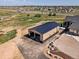 A large garage, complete with multiple doors and a metal roof, with plenty of space for parking at 14025 Florence Ct, Brighton, CO 80602