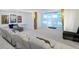 Comfortable home theater with tiered seating, a large projection screen, and ambient lighting for an immersive experience at 14025 Florence Ct, Brighton, CO 80602