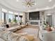 Cozy living room featuring plush seating, fireplace, and view of the outdoors at 14025 Florence Ct, Brighton, CO 80602