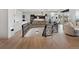 Staircase leading into living area with metal railing and open floor plan at 14025 Florence Ct, Brighton, CO 80602