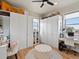 Bright walk-in closet with custom shelving, plenty of storage, and natural light at 14025 Florence Ct, Brighton, CO 80602