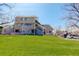 A spacious lawn area slopes gently toward the home, providing ample space for outdoor activities and recreation at 12486 W Nevada Pl # 106, Lakewood, CO 80228