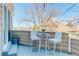 Balcony with seating area and views of mature trees at 12486 W Nevada Pl # 106, Lakewood, CO 80228