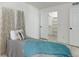 Bedroom features natural light, closet access and sleek hardwood floors at 12486 W Nevada Pl # 106, Lakewood, CO 80228