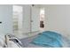 Bedroom featuring natural light, closet and bathroom access and sleek hardwood floors at 12486 W Nevada Pl # 106, Lakewood, CO 80228