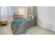 Cozy bedroom with stylish decor, natural light, and hardwood floors at 12486 W Nevada Pl # 106, Lakewood, CO 80228