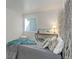 Bedroom features stylish decor, natural light, and hardwood floors at 12486 W Nevada Pl # 106, Lakewood, CO 80228