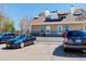 Exterior view of the building, showcasing the facade and parking area at 12486 W Nevada Pl # 106, Lakewood, CO 80228
