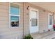 Close-up of the front entrance showcasing the unit number, a white door, and a well-lit exterior at 12486 W Nevada Pl # 106, Lakewood, CO 80228