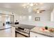 Modern kitchen with stainless steel oven and stove, sleek countertops, and lots of light at 12486 W Nevada Pl # 106, Lakewood, CO 80228