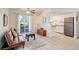 Bright living room with hardwood floors, a ceiling fan, and a sliding glass door to a balcony at 12486 W Nevada Pl # 106, Lakewood, CO 80228