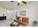 Cozy living room with a decorative fireplace, comfortable seating, and ample natural light at 12486 W Nevada Pl # 106, Lakewood, CO 80228