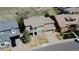 Overhead shot of the home featuring a neutral exterior color, landscaped yard, and tile roof at 3873 Fairbrook Pt, Highlands Ranch, CO 80130