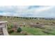 Expansive backyard showcasing scenic views of the neighborhood and beyond at 3873 Fairbrook Pt, Highlands Ranch, CO 80130