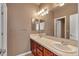 Bathroom features dual sinks, vanity mirrors and adequate lighting at 3873 Fairbrook Pt, Highlands Ranch, CO 80130