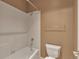Bathroom featuring shower-tub and toilet at 3873 Fairbrook Pt, Highlands Ranch, CO 80130
